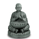 Mönch in Meditation mit Schale